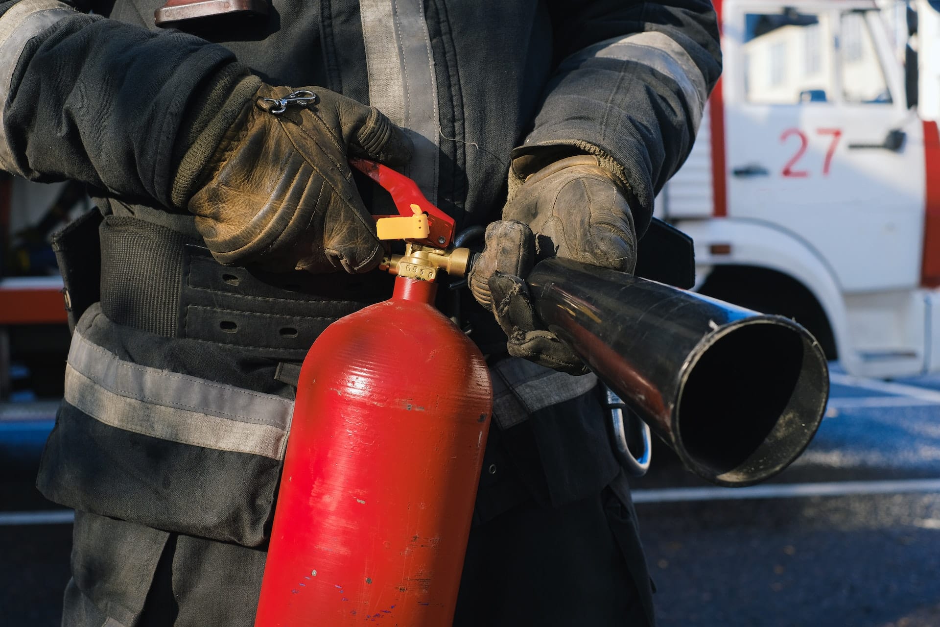 firefighter with extinguisher